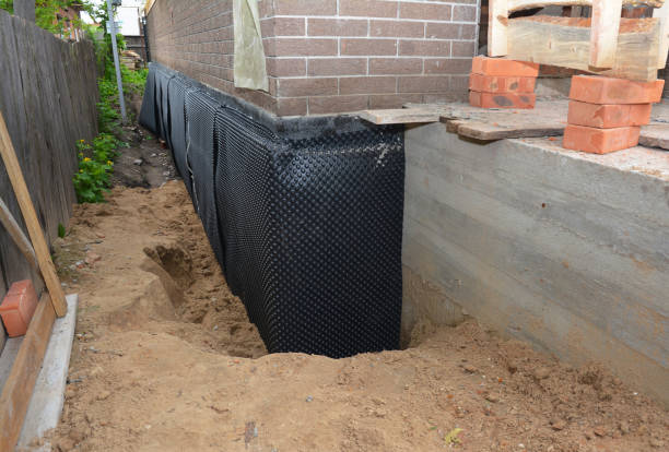 Happy homeowners after waterproofing job in Coosada